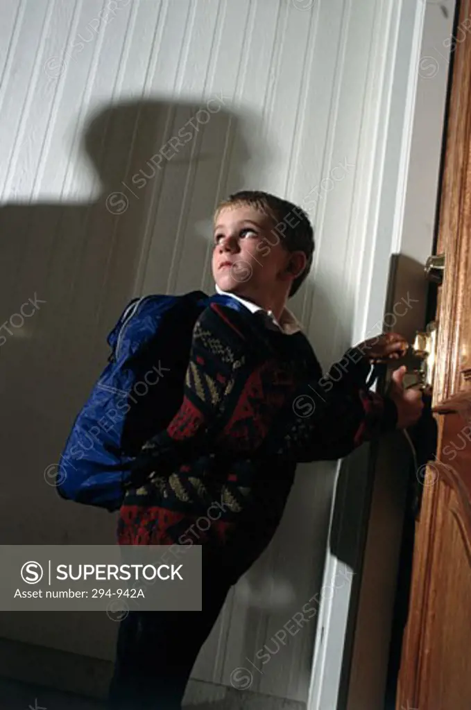 Boy looking frightened from the shadow of a person