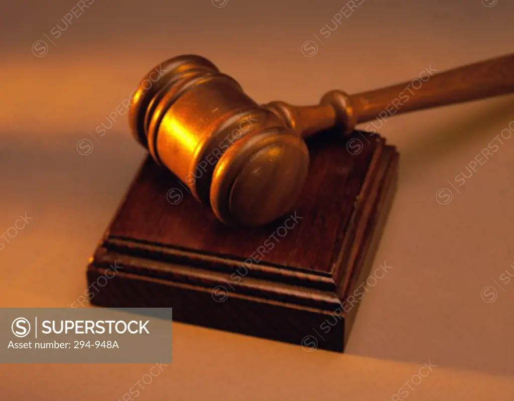 Close-up of a gavel on a wooden block