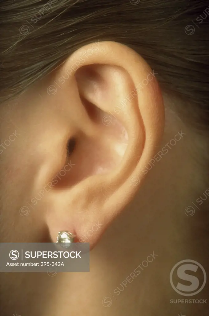 Close-up of a diamond earring on a woman's ear