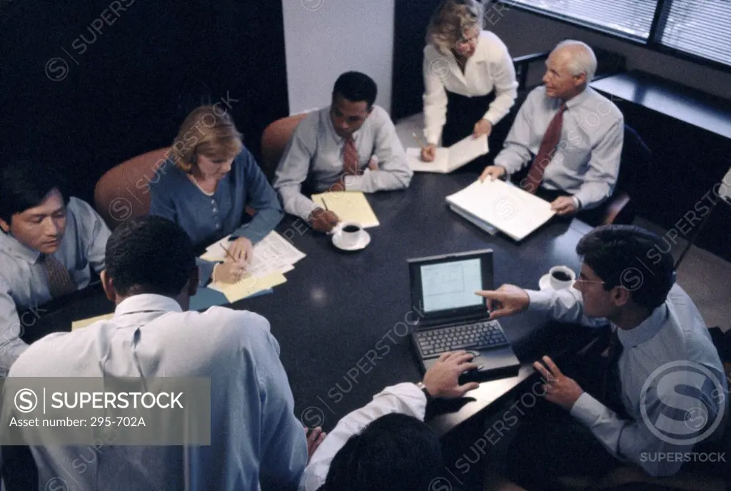 High angle view of business executives talking in a conference room