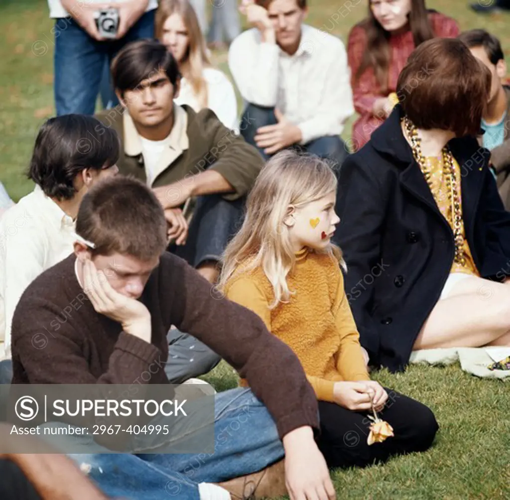 Group of people sitting in a park in a love-in, Griffith Park, Los Angeles, California, USA