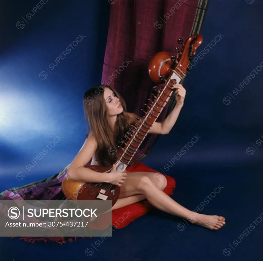 Young woman playing a veena