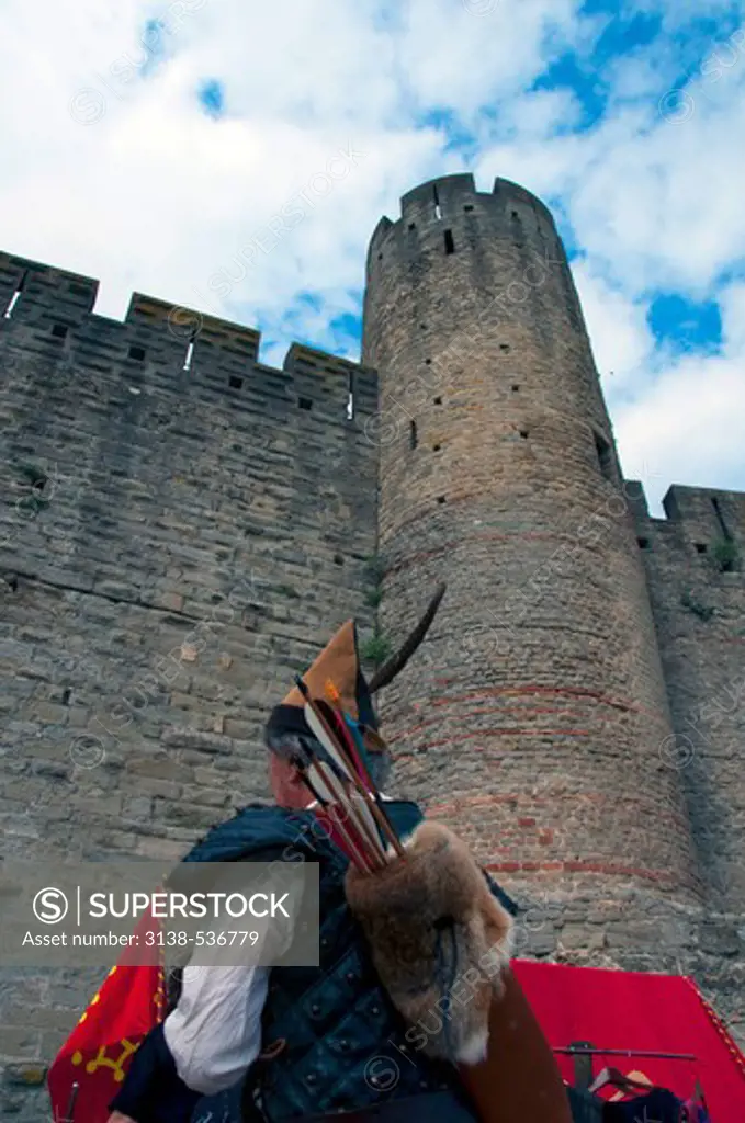 Archer in front of a fortress, Carcassonne, Aude, Languedoc-Rousillon, France
