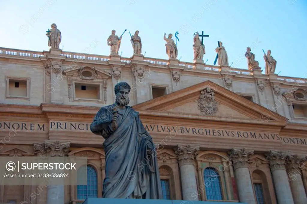Statue in front of a church, St. Peter's Basilica, St. Peter's Square, Vatican city, Rome, Italy