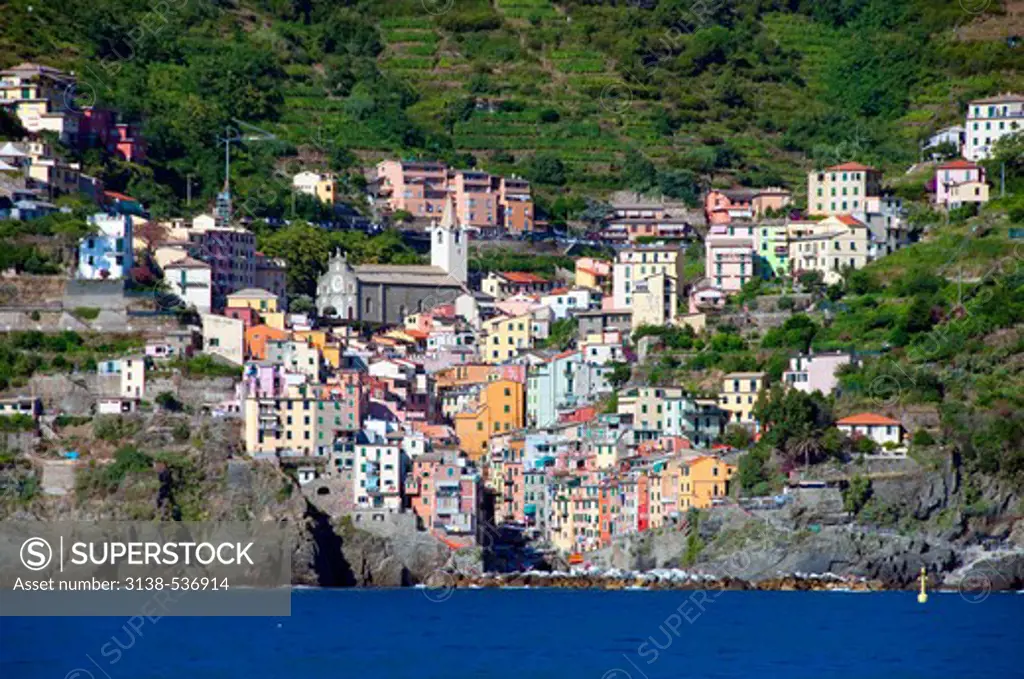 Buildings and a church in a town, Riomaggiore, La Spezia Province, Liguria, Italy