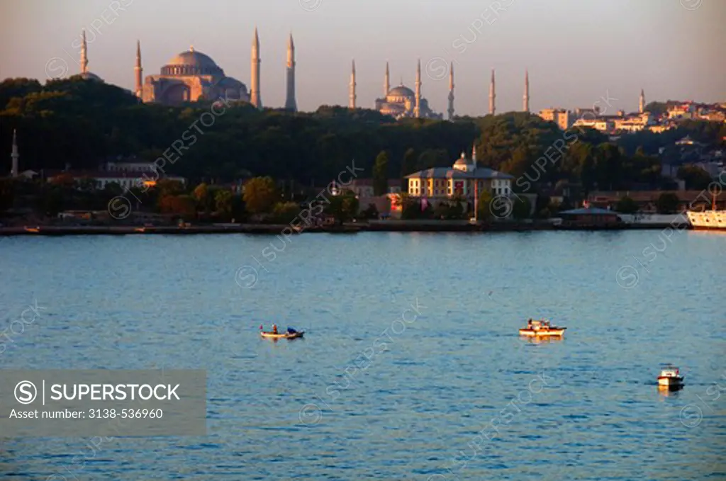 Boats in a strait with a mosque and a museum in the background, Blue Mosque, Aya Sofya, Bosphorus, Istanbul, Turkey