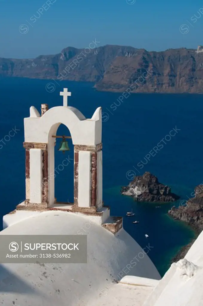 Bell tower of a church at the waterfront, Santorini, Cyclades Islands, Greece