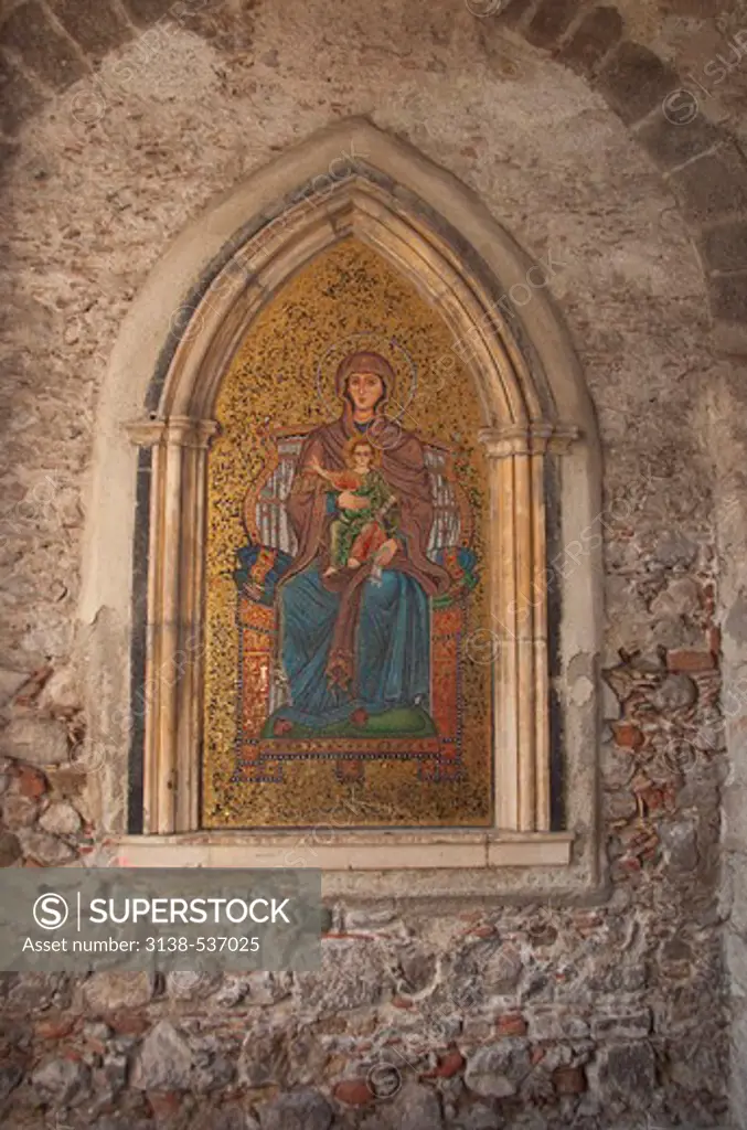 Mural of the Virgin Mary and Jesus Christ on a wall, Taormina, Sicily, Italy