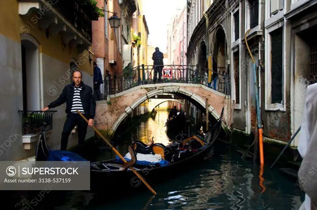 Man rowing a gondola, Grand Canal, Venice, Veneto, Italy