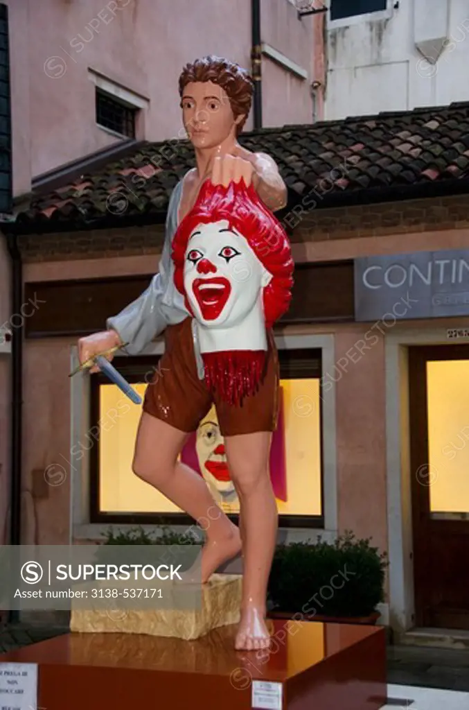 Ronald McDonald statue at the courtyard of a building, Venice, Veneto, Italy