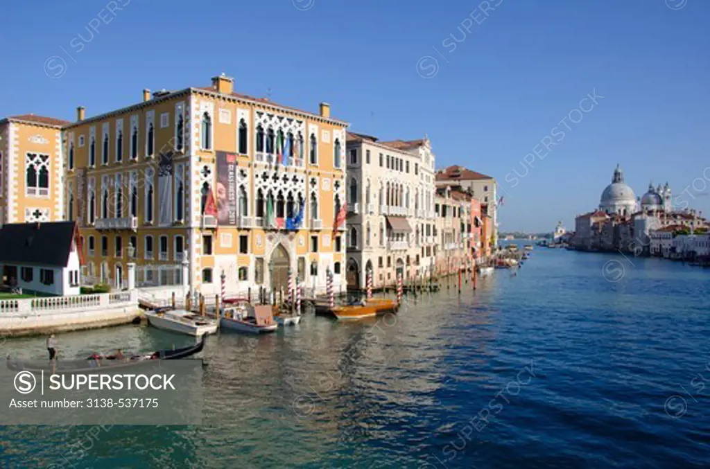 Gondolas in a canal with a church in the background, Santa Maria Della Salute, Grand Canal, Venice, Veneto, Italy