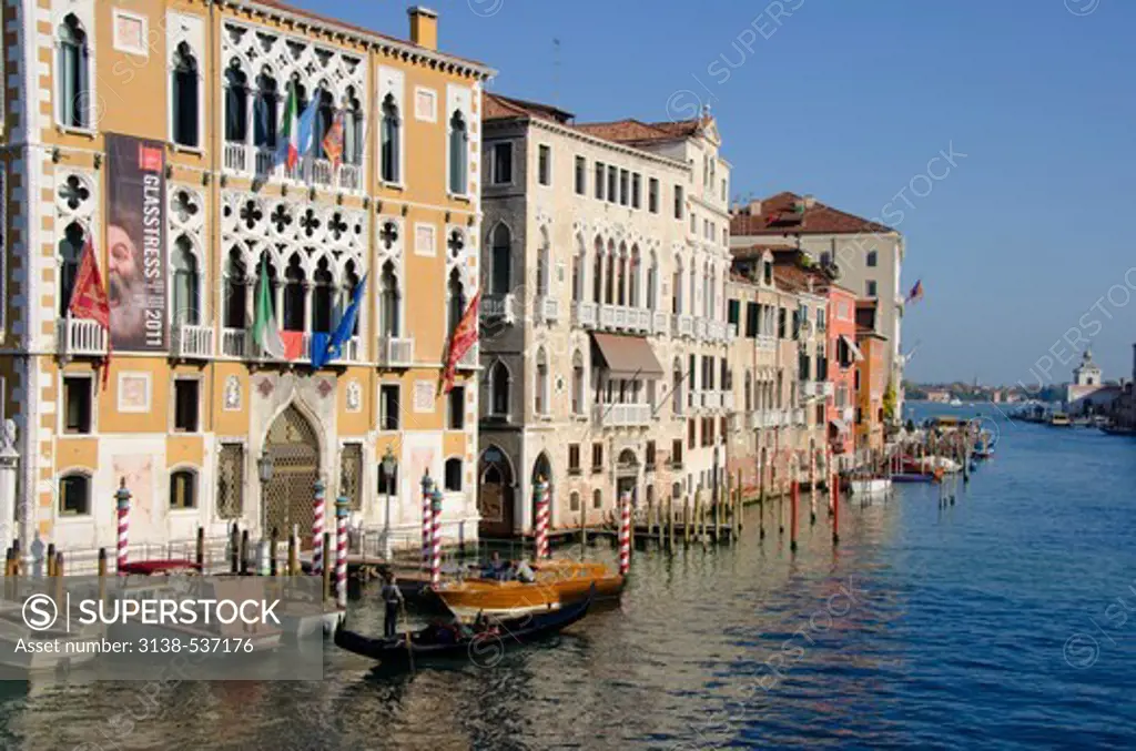 Gondolas in a canal with a church in the background, Santa Maria Della Salute, Grand Canal, Venice, Veneto, Italy
