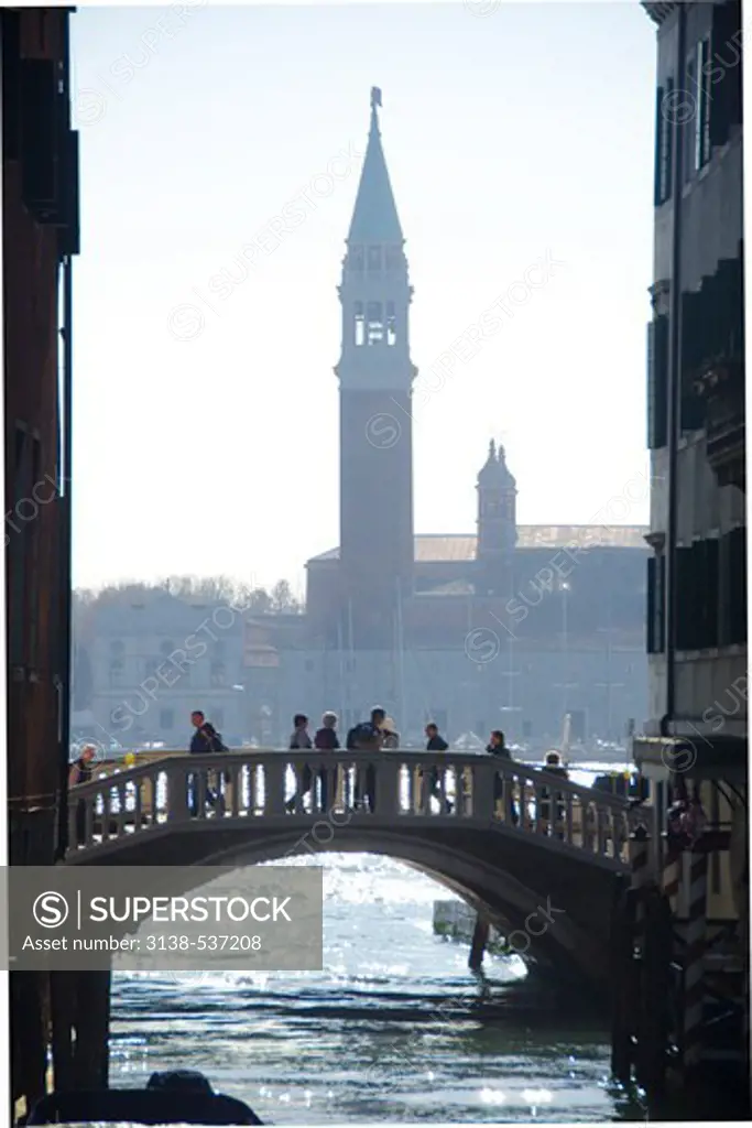 Bridge of Sighs across a canal with the Church of San Giorgio Maggiore in the background, , Grand Canal, Venice, Veneto, Italy