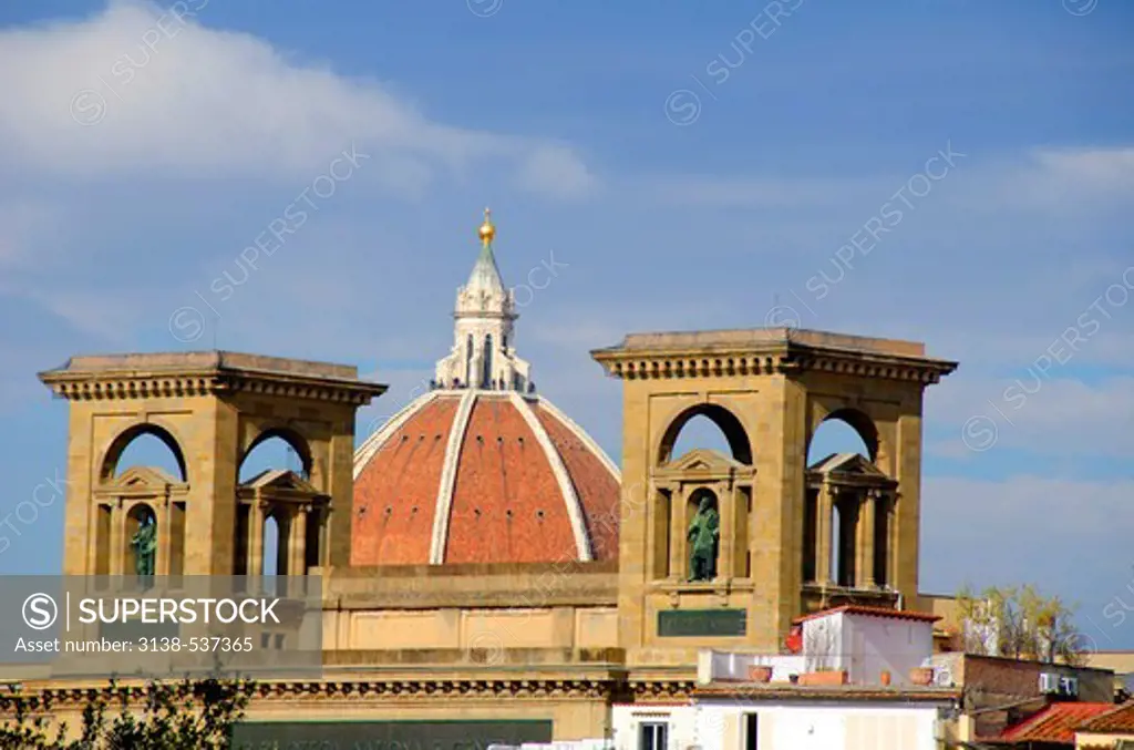 Church dome seen between the twin towers of the Uffizi Museum, Duomo Santa Maria Del Fiore, Piazzale Michelangelo, Florence, Tuscany, Italy