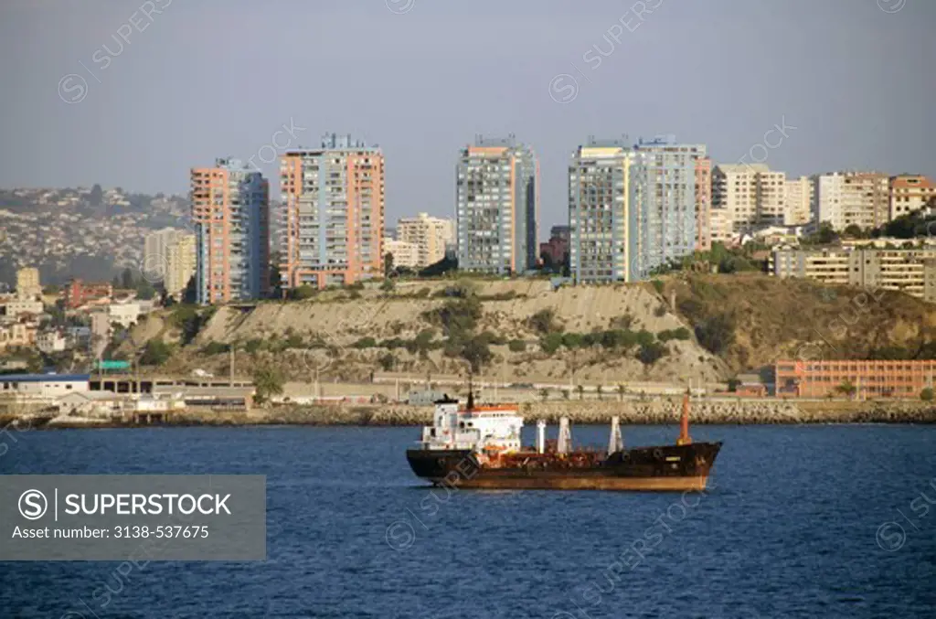 Steamer ship in an ocean with city in the background, Vina del Mar, Valparaiso Region, Chile