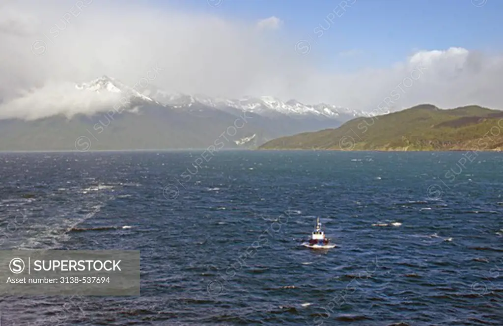 Boat in a fjord with mountains in the background, Beagle Channel, Tierra del Fuego, Chile