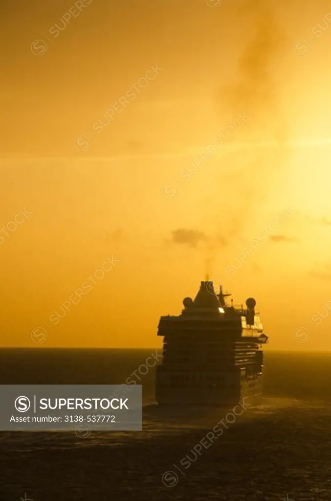 Cruise ship moving in the sea at sunset, St. Barthelemy, France