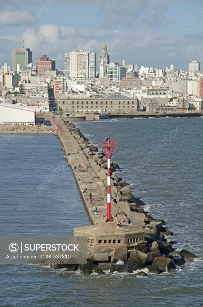Jetty with city at waterfront, Montevideo, Uruguay
