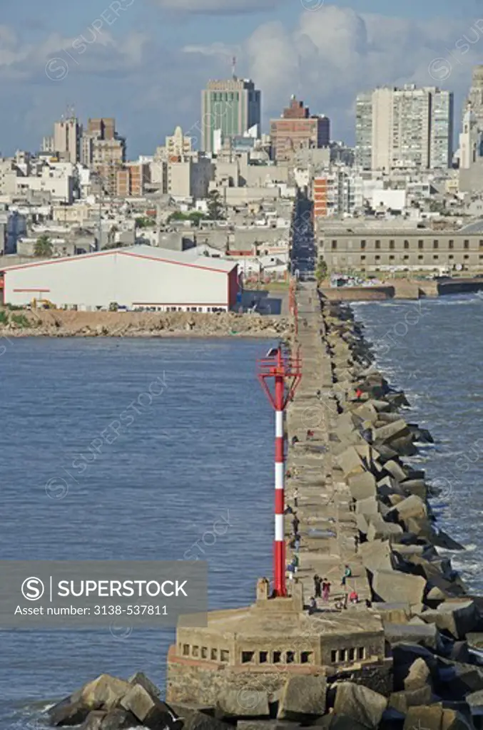 Jetty with city at waterfront, Montevideo, Uruguay