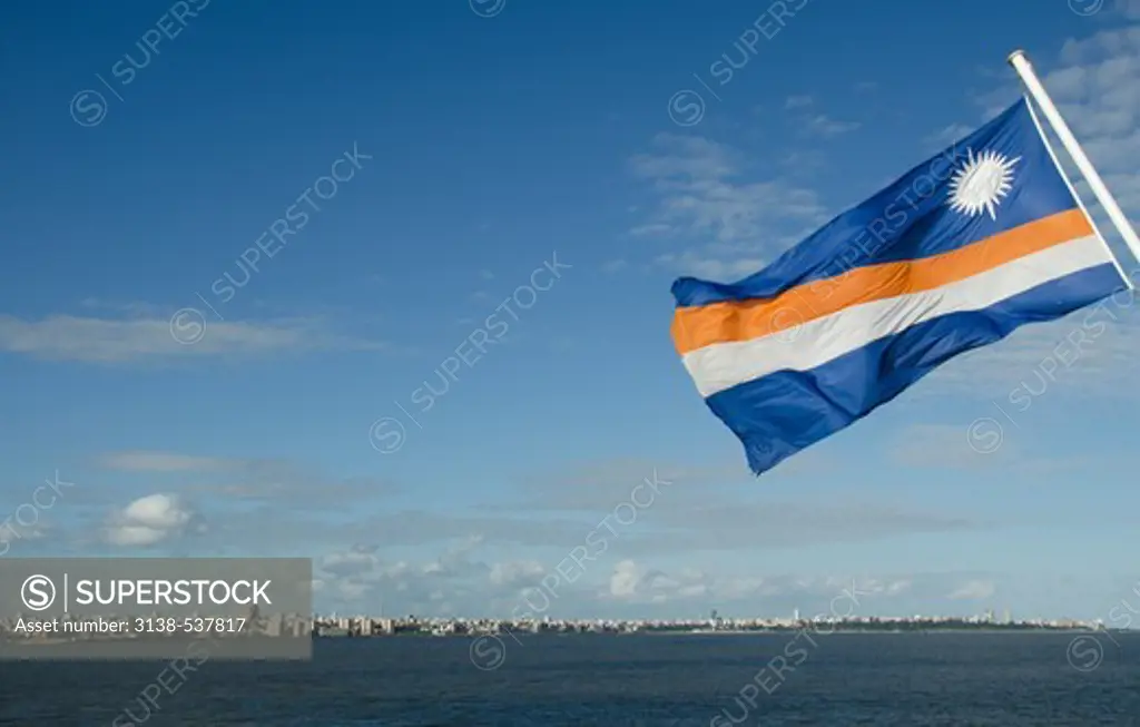 Flag with city in the background, Montevideo, Uruguay