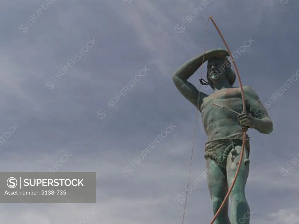 Low angle view of a statue of a Tehuelche Indian tribal man, Puerto Madryn, Chubut, Patagonia, Argentina