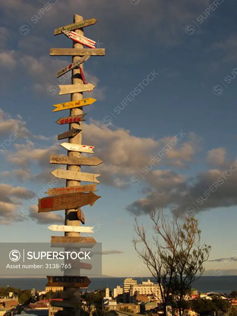 Road signs on a wooden post, Magellan, Patagonia, Chile