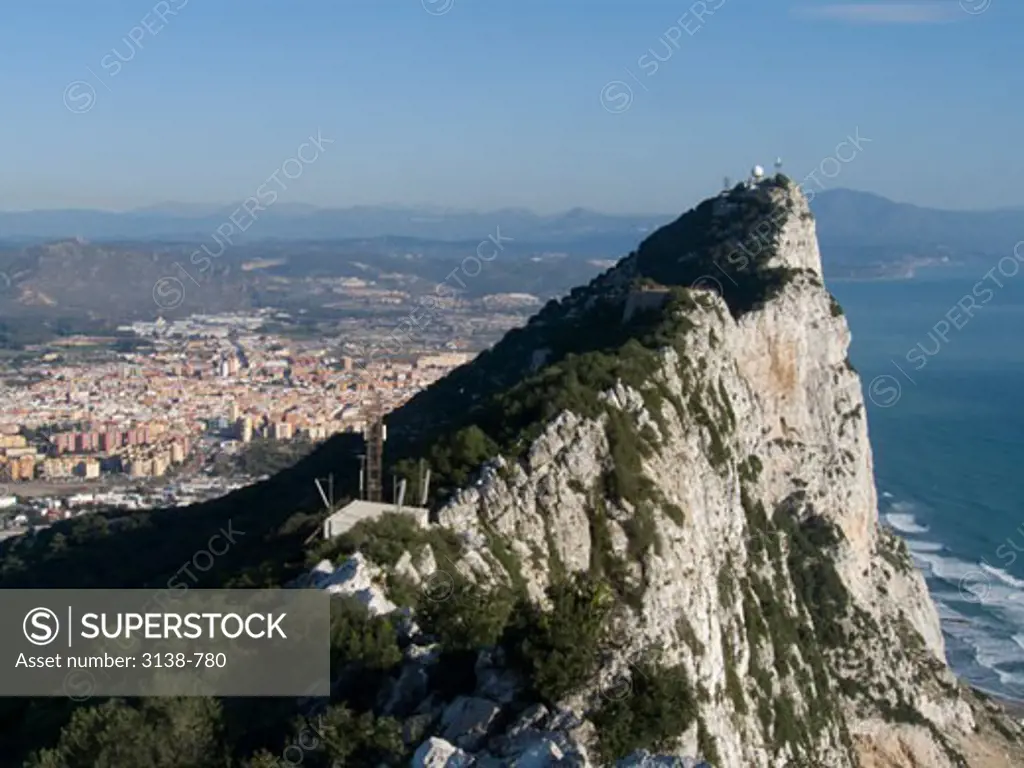 Rock formation with a city in the background, Rock of Gibraltar, Gibraltar, Spain