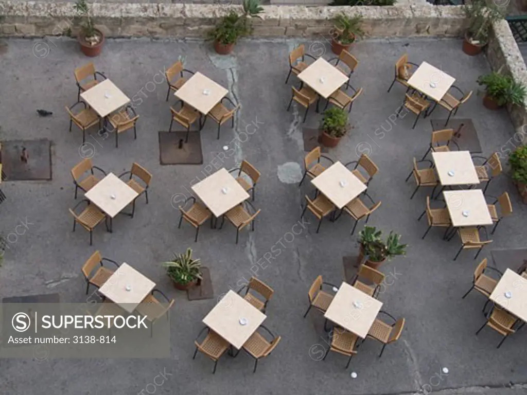 High angle view of empty tables and chairs in a restaurant, Malta