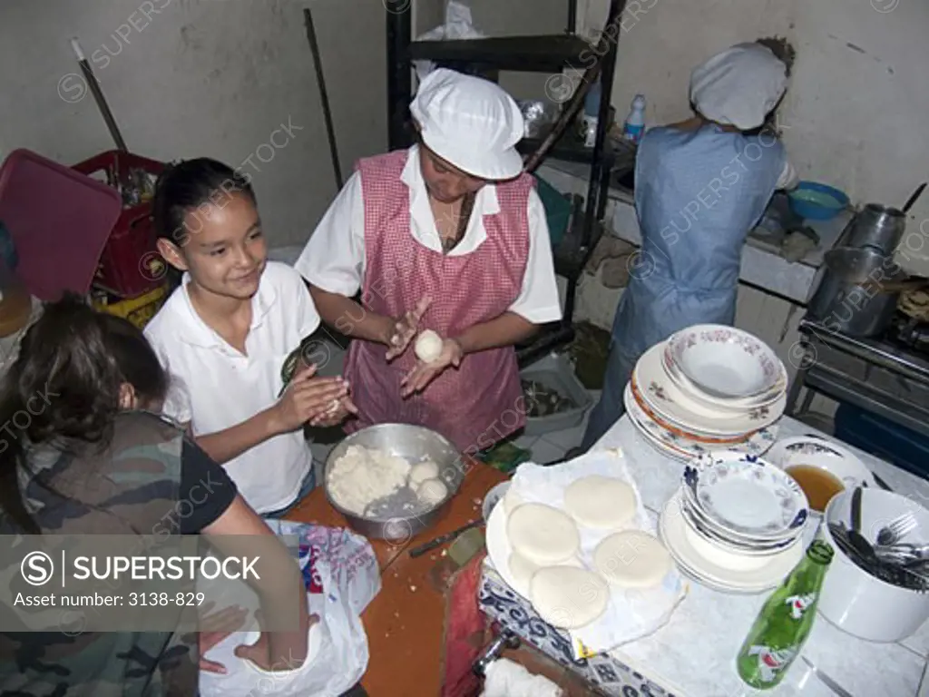 Chefs making tortillas in the kitchen, Bogota, Colombia
