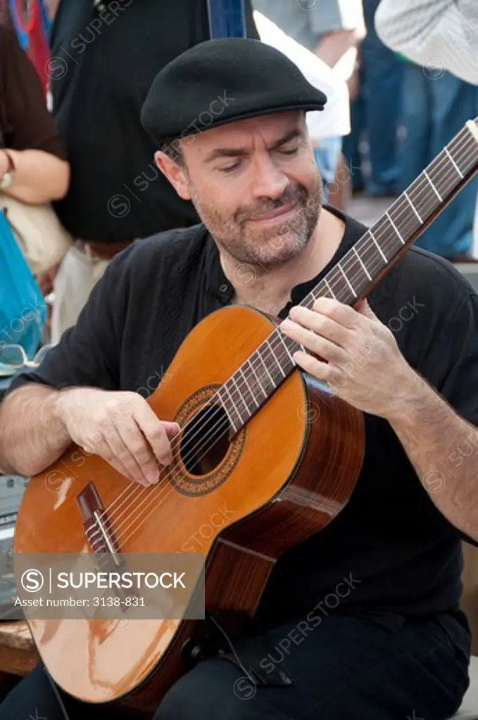 Man playing a guitar, San Telmo, Buenos Aires, Argentina