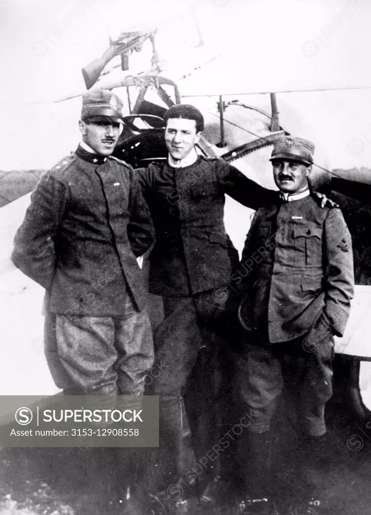 Lieutenant Francesco Baracca with two other airmen (far left) posing at the school Caproni in Malpensa, 1915