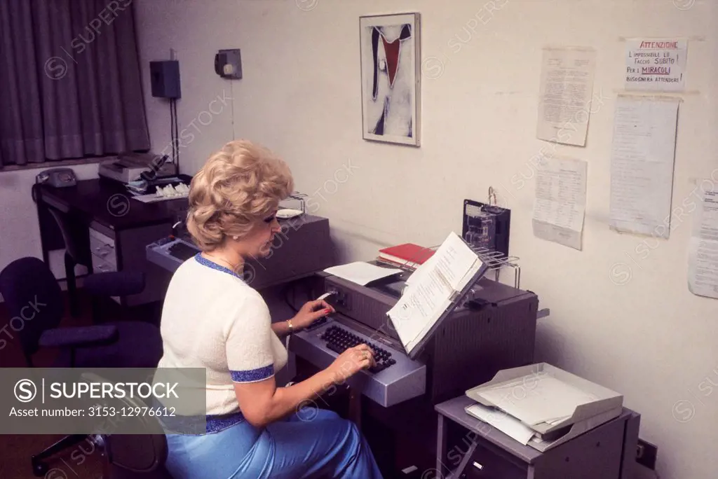 secretary using telex, 70's