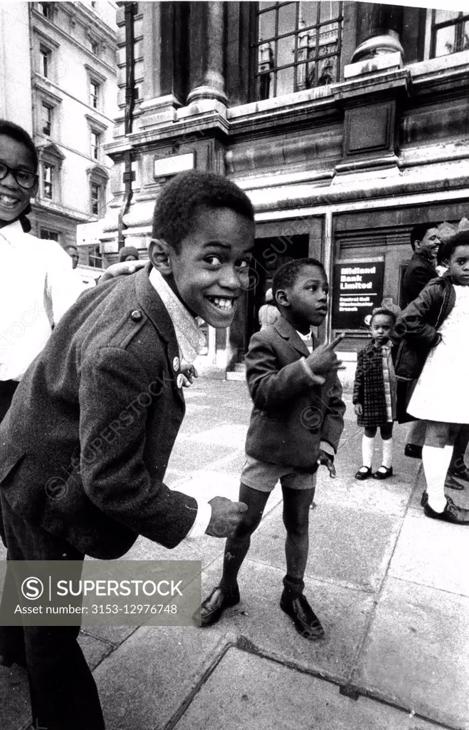 black children in a street of london, uk, 70's,