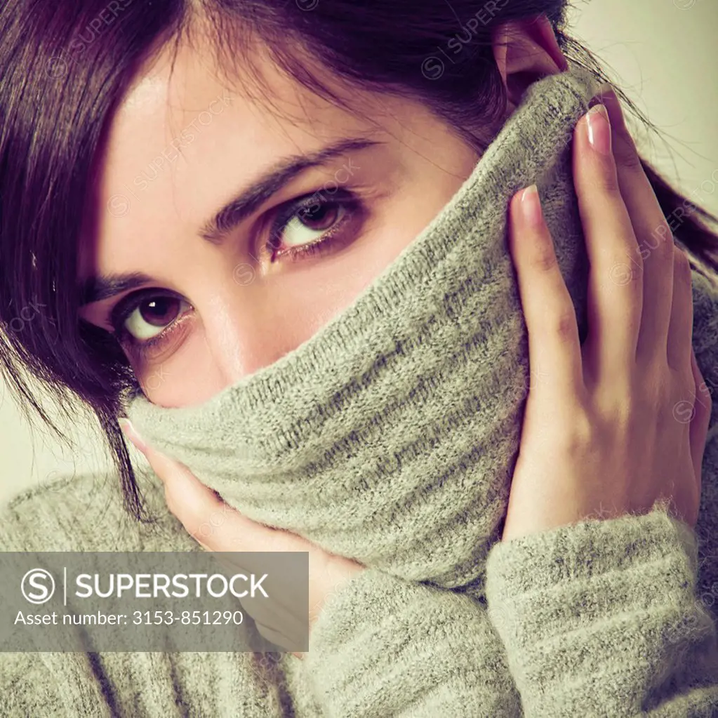 young woman with sweater on the face