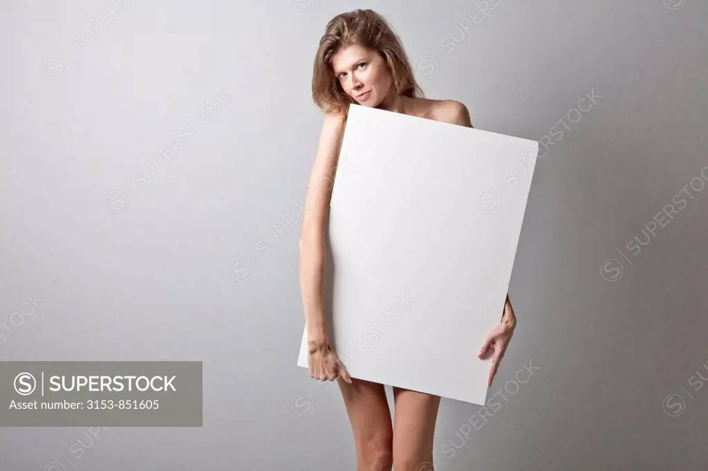 young woman holding white panel