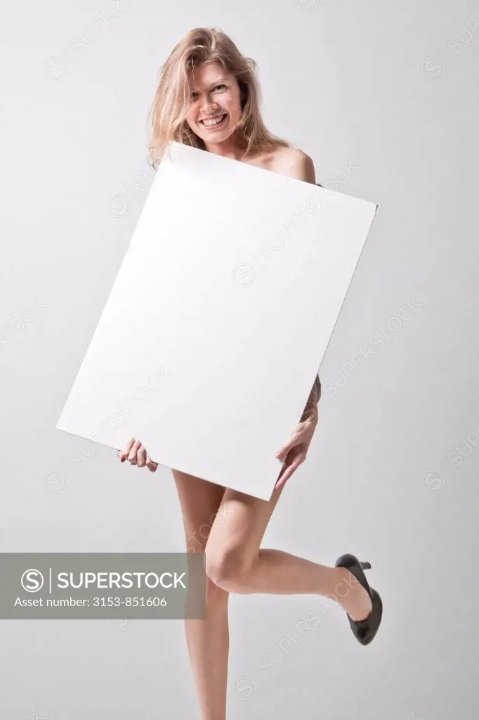 young woman holding white panel