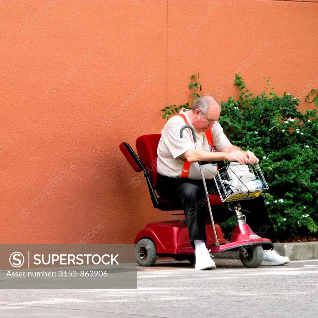 disabled man in an electric wheelchair