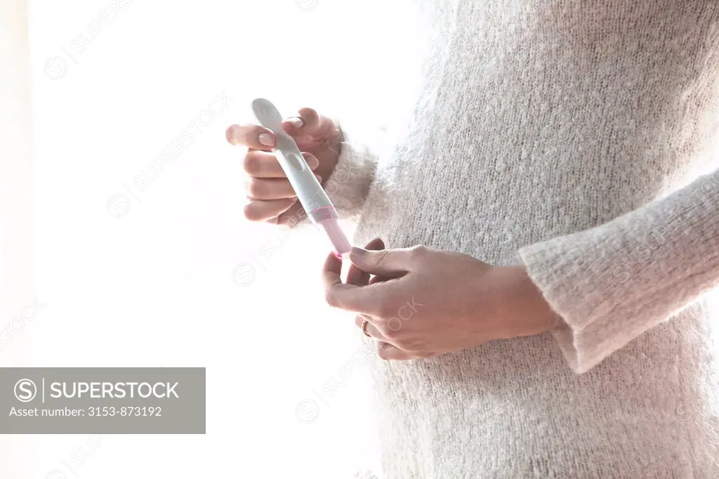 woman with pregnancy test