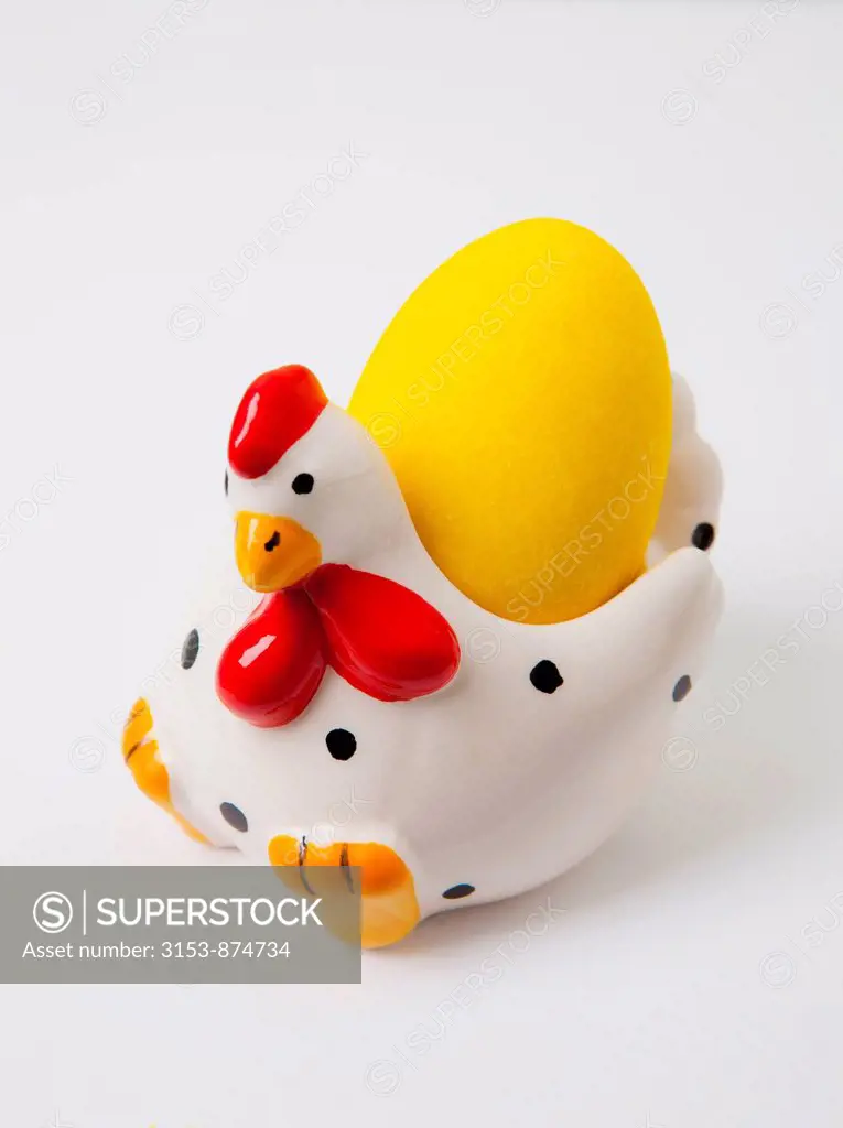 chicken ceramic egg cup with yellow sugar easter egg