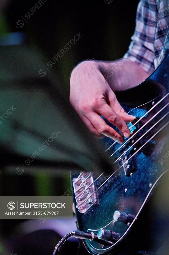 man while playing electric guitar