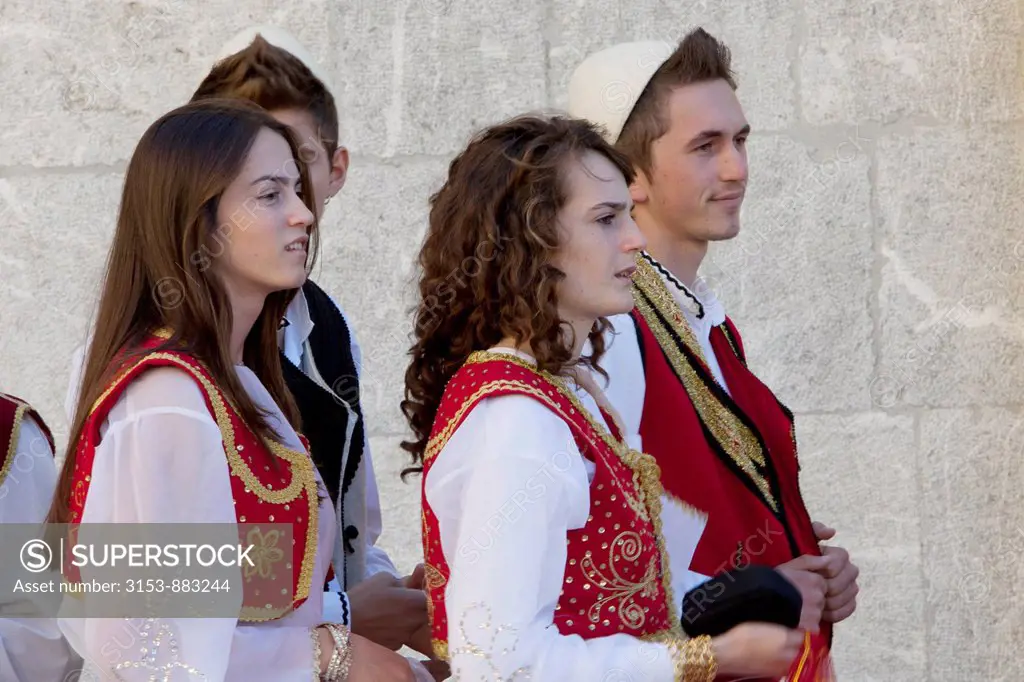 young people in traditional clothes during a wedding, Shkodra, Albania
