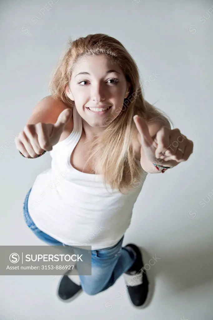 teenage girl with thumbs up