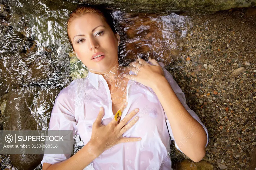 woman lying in a stream
