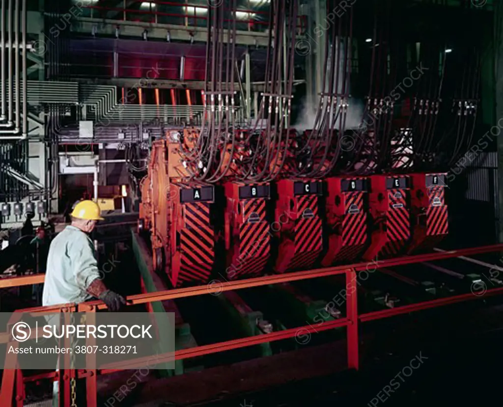 Side profile of a manual worker in a steel factory