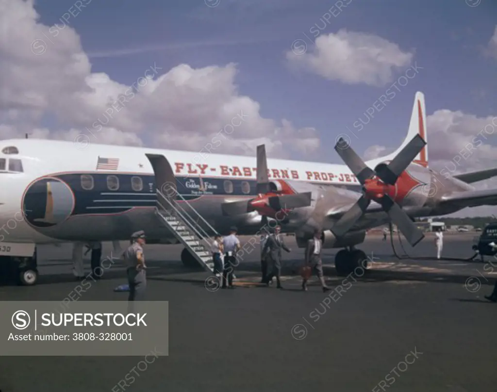 Passengers disembarking from an airplane, Lockheed Electra, Atlanta, Georgia, USA