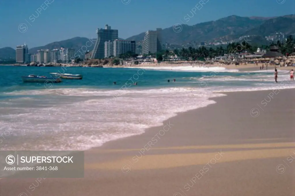 Tourists on the beach, Crown Plaza Hotel Acapulco, Condesa Beach, Acapulco, Mexico
