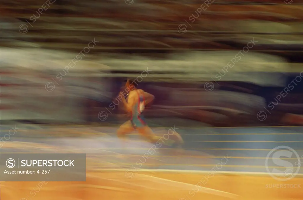 Athlete running on a track
