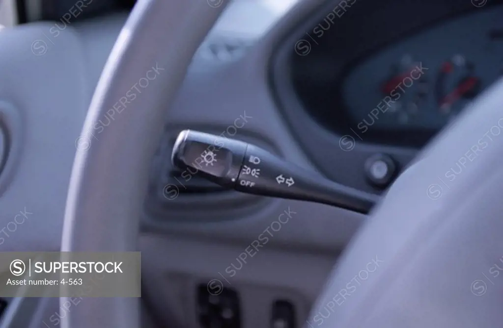 Close-up of a lights lever in a car