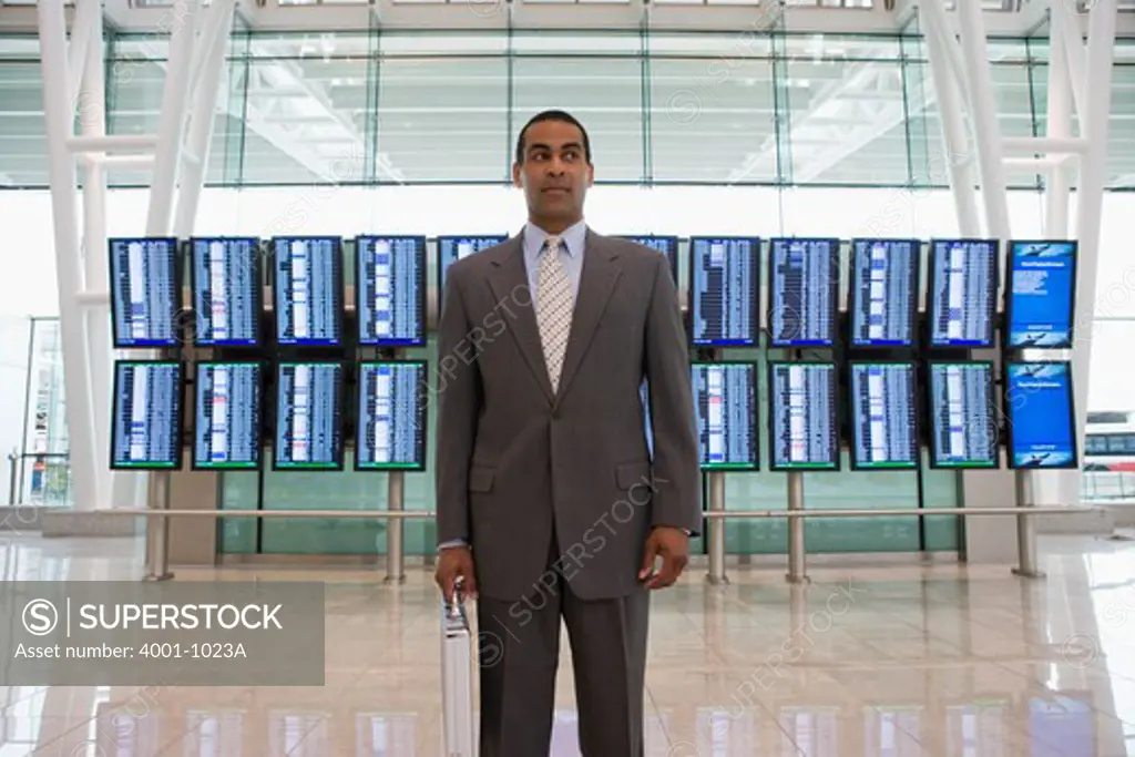 Businessman checking arrival and departure times