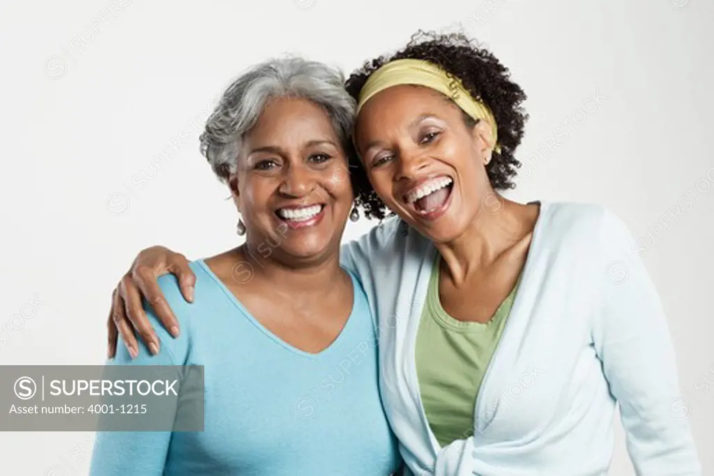 Portrait of a senior woman with her daughter smiling